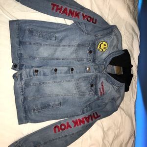 Denim jacket, it’s light blue.